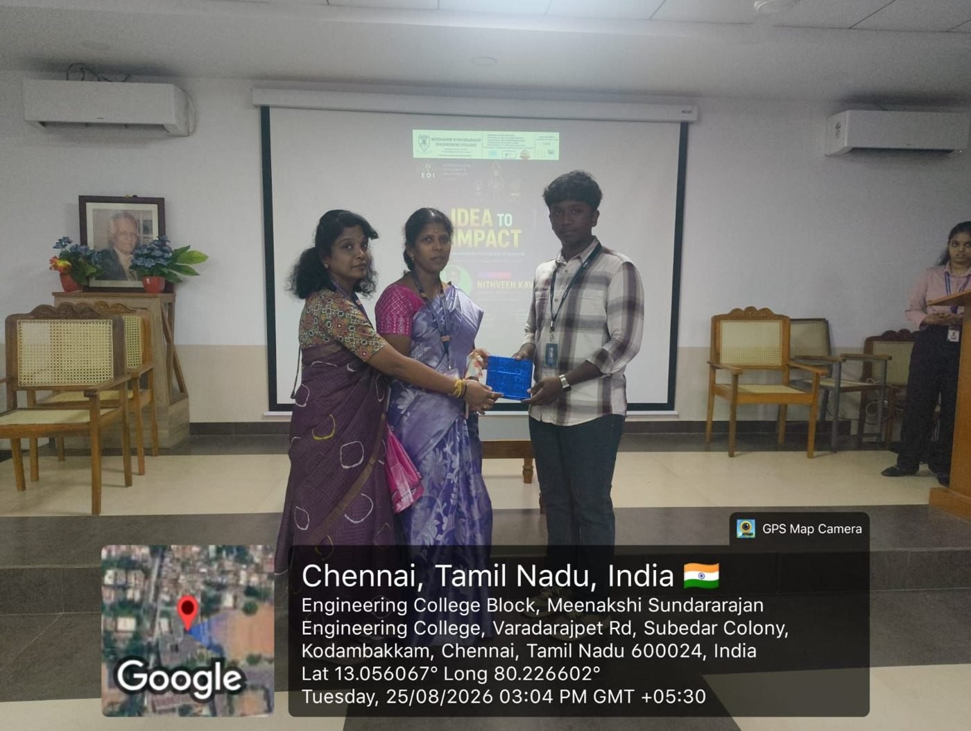Faculty presenting a memento to the EFLABS founder
